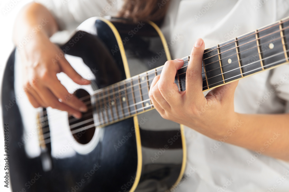 Εκτύπωση καμβά Close up of guitarist hand playing guitar, macro shot