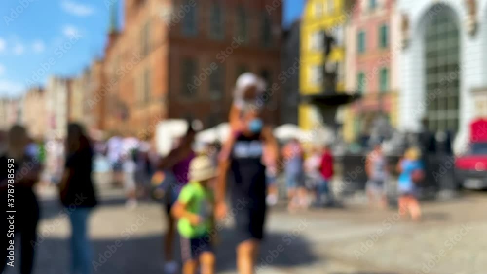 Tourists Walking By The Fountain Of Neptune Landmark In Ulica Dluga Gdansk Poland - slow motion shot Tourists Walking By The Fountain Of Neptune Landmark In Ulica Dluga Gdansk Poland - slow motion shot