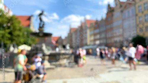 Wallpaper Mural Blurry Scenery Of Gdansk Old Town With Tourists Taking Photos Of The Fountain Of Neptune In A Plaza - wide shot Torontodigital.ca