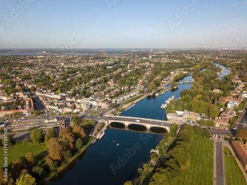 Hampton Court Bridge is a bridge that crosses the River Thames in England approximately north–south between Hampton, London and East Molesey, Surrey. 