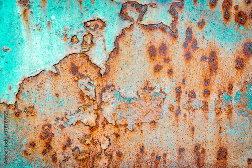 blue, rusty and grunge painted metal texture of a junk car body