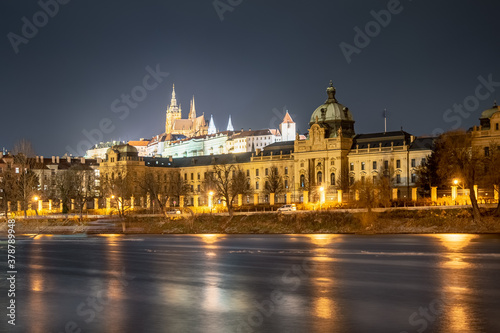 two most important buildings in Prague over Vltava river. Strakova Akademie in foreground is the seat of the Government of the Czech Republic, Prague Castle in background is the seat of the president