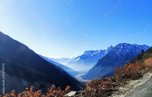 Clear blue range of Mountain in Sunny morning , peaks are having snow, at the bottom flowing river beautiful climate 