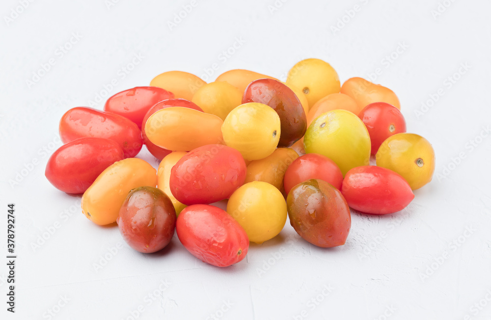 Tomatoes of different colors. On white background