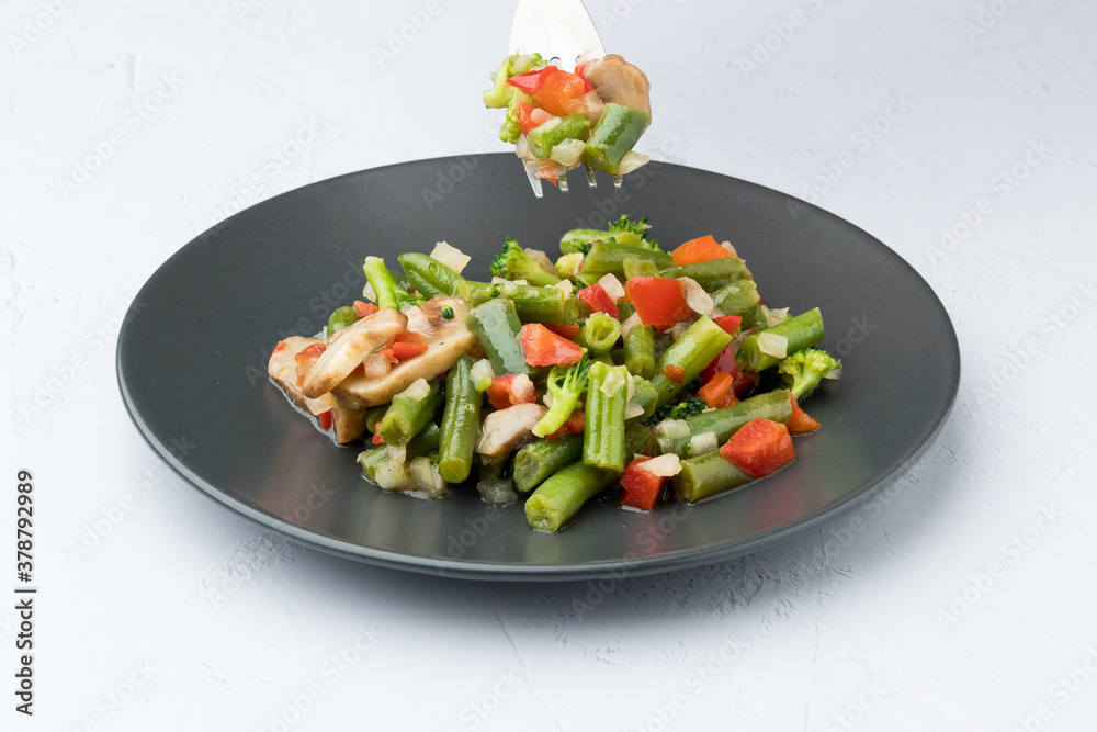 Sauteed vegetables, on white background. In study Sauteed vegetables, on white background. In study