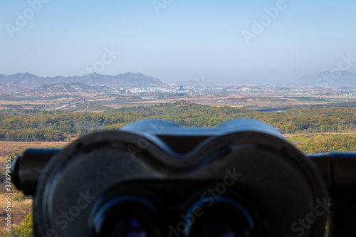 A view into North Korea across the DMZ from South Korea, from behind binoculars