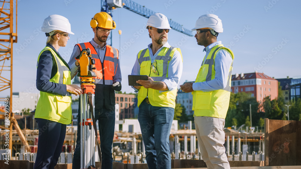 Diverse Team of Specialists Use Tablet Computer on Construction Site. Real Estate Building Project with Civil Engineer, Architect, Business Investor and Surveyor with Theodolite Discussing Plans. Diverse Team of Specialists Use Tablet Computer on Construction Site. Real Estate Building Project with Civil Engineer, Architect, Business Investor and Surveyor with Theodolite Discussing Plans.