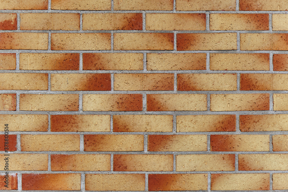 The modern brick facade wall of the building.