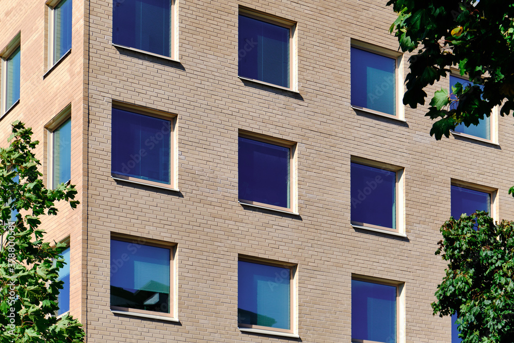 The blue windows in the brick wall. Modern Nordic architecture.