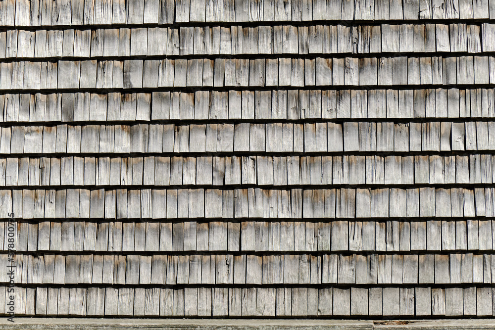 The wooden wall of the building. The pattern of wooden wall.