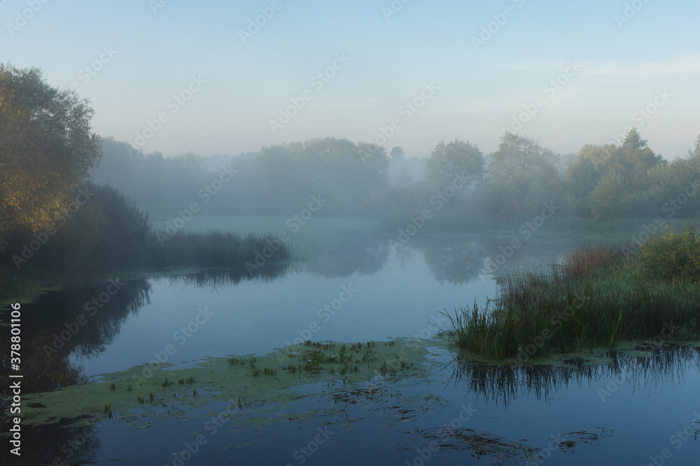 Morning fog over the river. Dawn