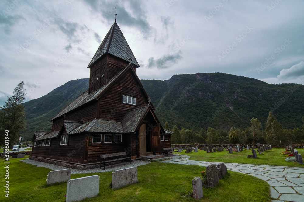 wooden røldal stave church in the summer time during cloudy day. Rølda, Norway