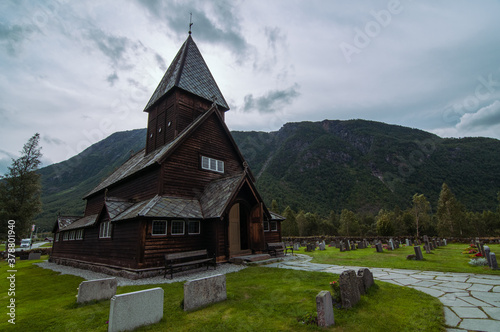 wooden røldal stave church in the summer time during cloudy day. Rølda, Norway photo