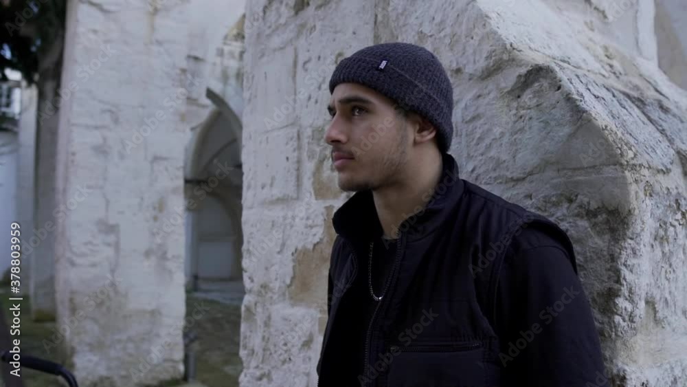 Young Handsome Man Leaning Against The Wall and Looking at Camera2 Young Handsome Man Leaning Against The Wall and Looking at Camera2