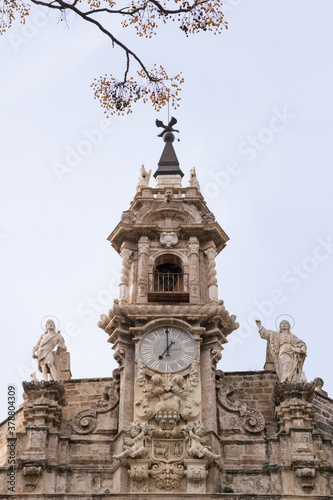 Clock tower of the church of santos juanes in valencia, spain photo