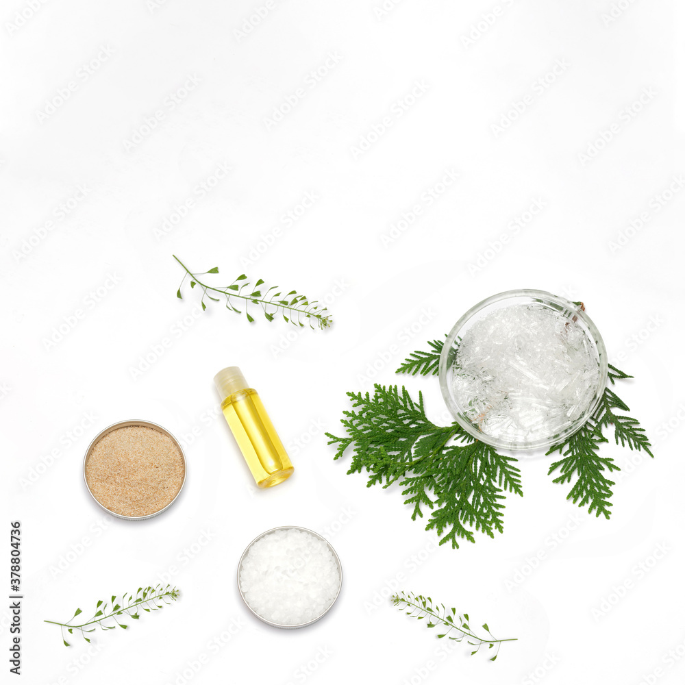 Ingredients for the production of cosmetics on a white background. Herbal powders, dried flowers, menthol crystals, oil. Natural cosmetics concept.