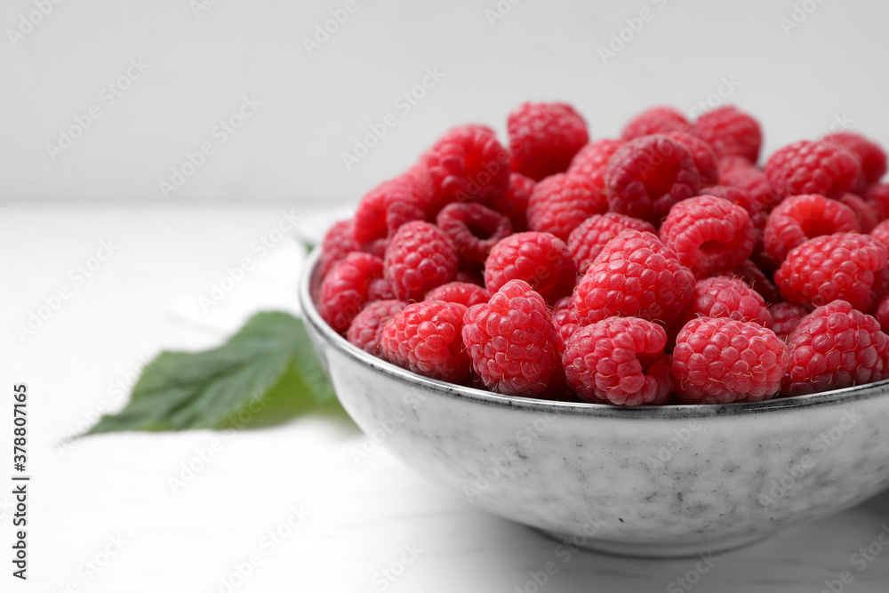 Delicious fresh ripe raspberries on white wooden table, closeup Delicious fresh ripe raspberries on white wooden table, closeup