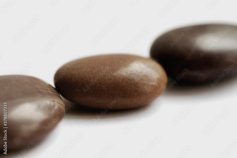 Close-up of three pebbles in a row Close-up of three pebbles in a row