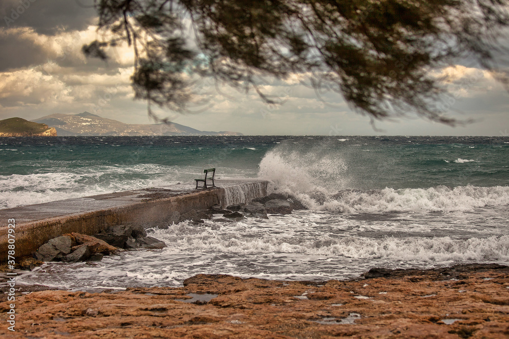 Empty jetty on a stormy day.  Ocean way hitting the jetty. Stock Image.
