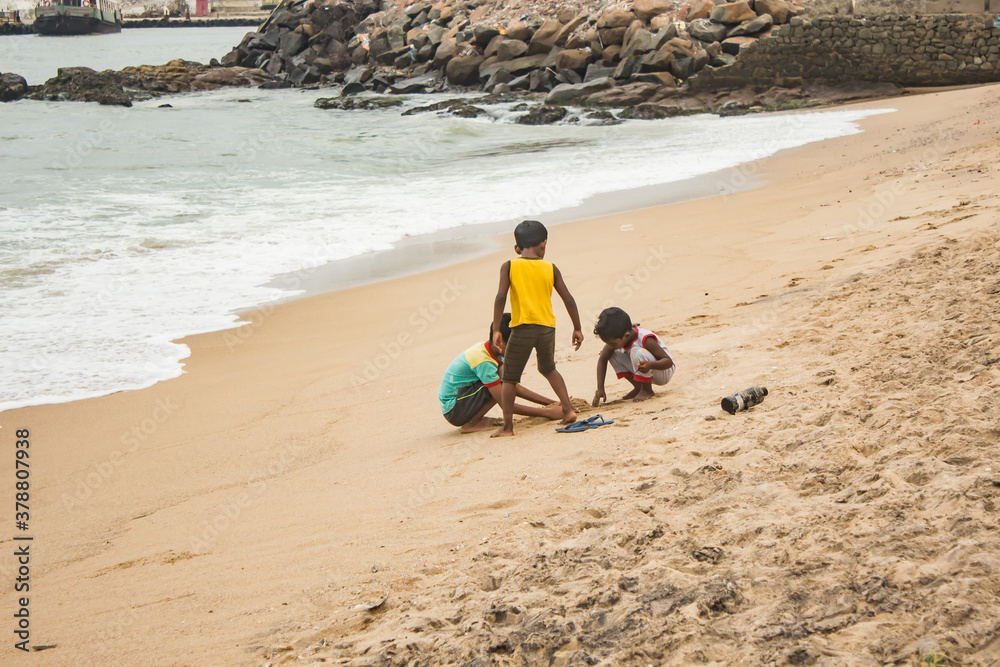 children playing on the beach with sand children playing on the beach with sand