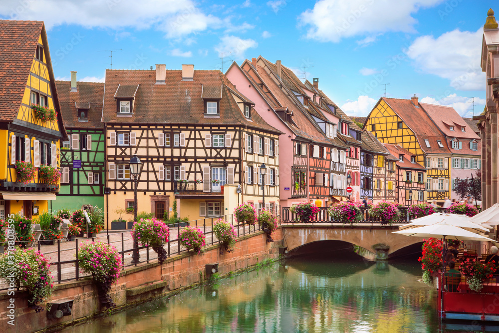 
Beautiful view of the historic town of Colmar, also known as Little Venice. Romantic charming streets  with colorful houses, canal and bridge. Summertime, France.