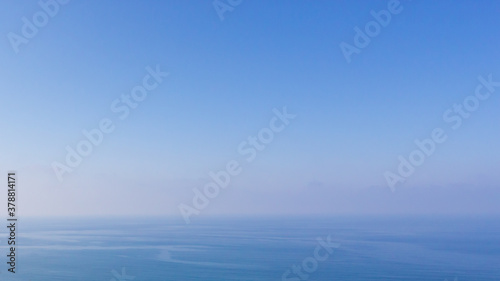 Blue water seascape abstract background. Clear blue sky