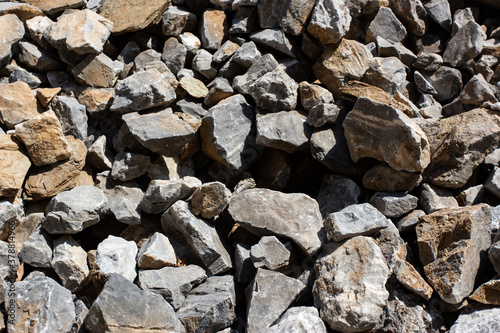 Gray large rock stones and debris background © Olga