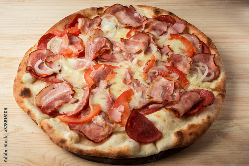 pizza with salami and tomatoes