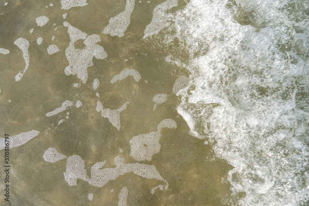 Tide Coming In Aerial top view of white waves and water tide coming in at the beach ...