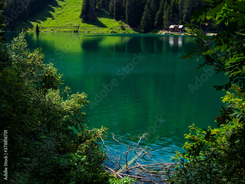 Lost in the mountains of Switzerland, Lake Arnesee with crystal clear waters of turquoise and azure colors.