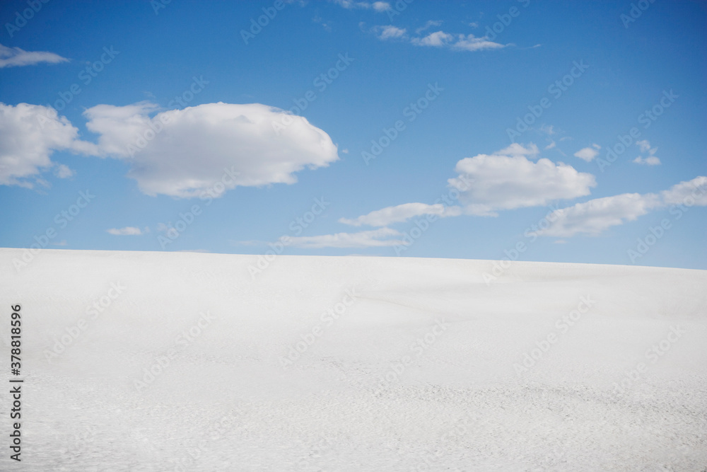 Clouds over snow covered landscape