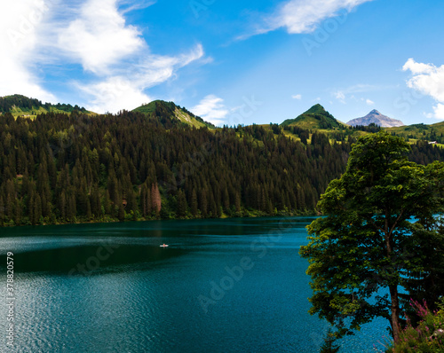 Lost in the mountains of Switzerland, Lake Arnesee with crystal clear waters of turquoise and azure colors. photo