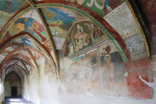 Ancient portico with religious frescoes in Brixen, Italy