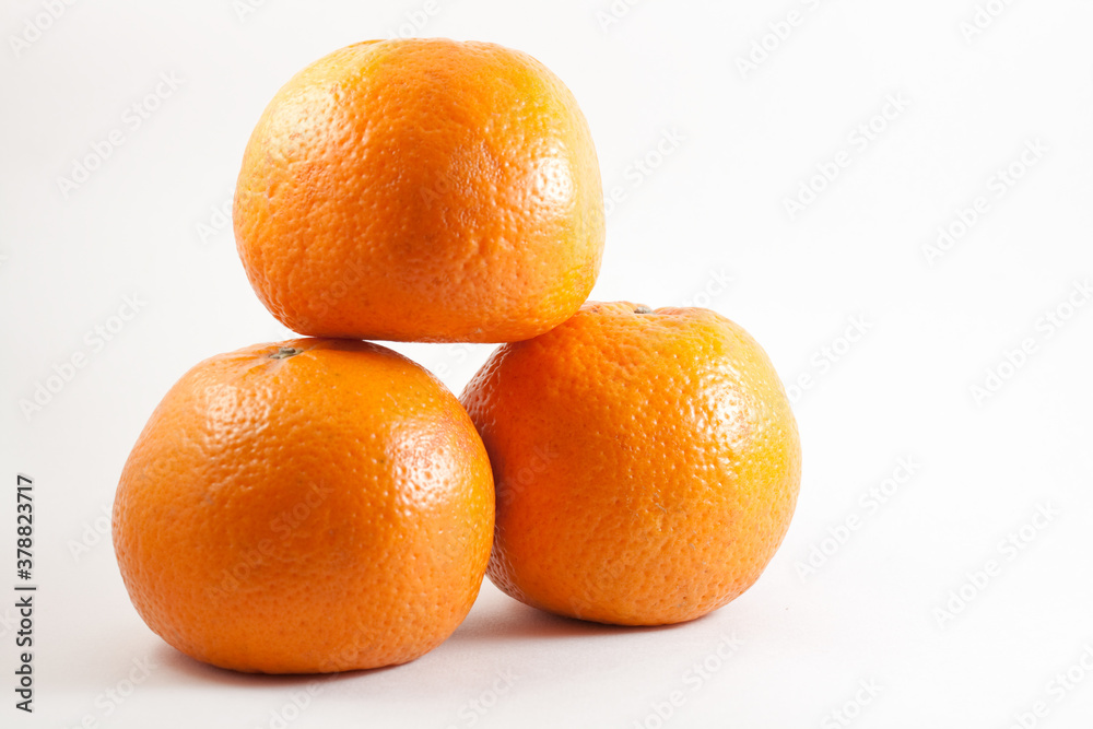 Image of three fresh oranges taken on a white isolated background Image of three fresh oranges taken on a white isolated background