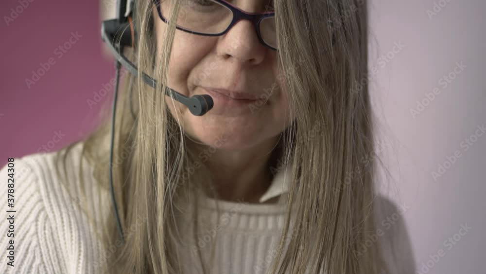 Woman wearing headset talking to customer medium shot Woman wearing headset talking to customer medium shot