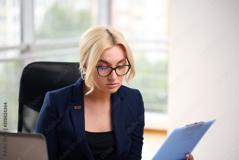 Work from home. Beautiful girl in a suit at the table, Work from home. Beautiful girl in a suit at the table,