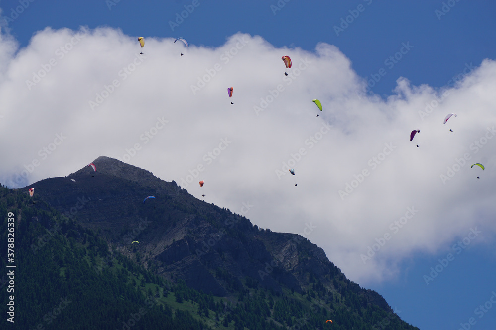 paragliders over the mountains in the French Alps paragliders over the mountains in the French Alps