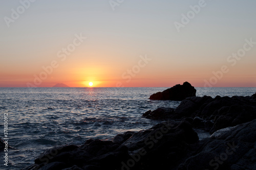 Sunset on the rocky shore. Tyrrhenian Sea.