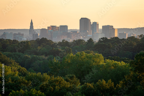 City of Hartford Connecticut skyline and trees at golden hour photo