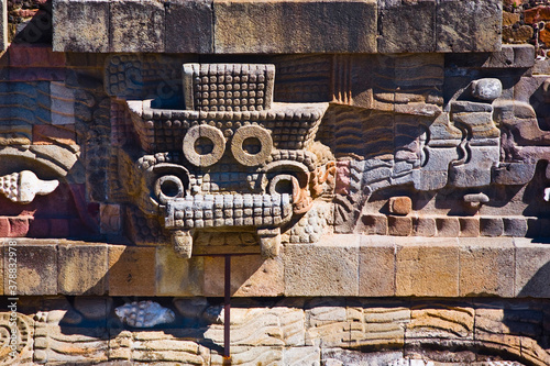 Sculpture carved on the wall of a temple, Temple of Quetzalcoatl, Teotihuacan, Mexico photo