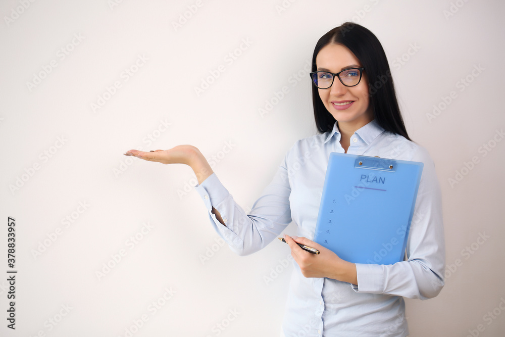 Smiling businesswoman showing open hand palm with copy space for Smiling businesswoman showing open hand palm with copy space for