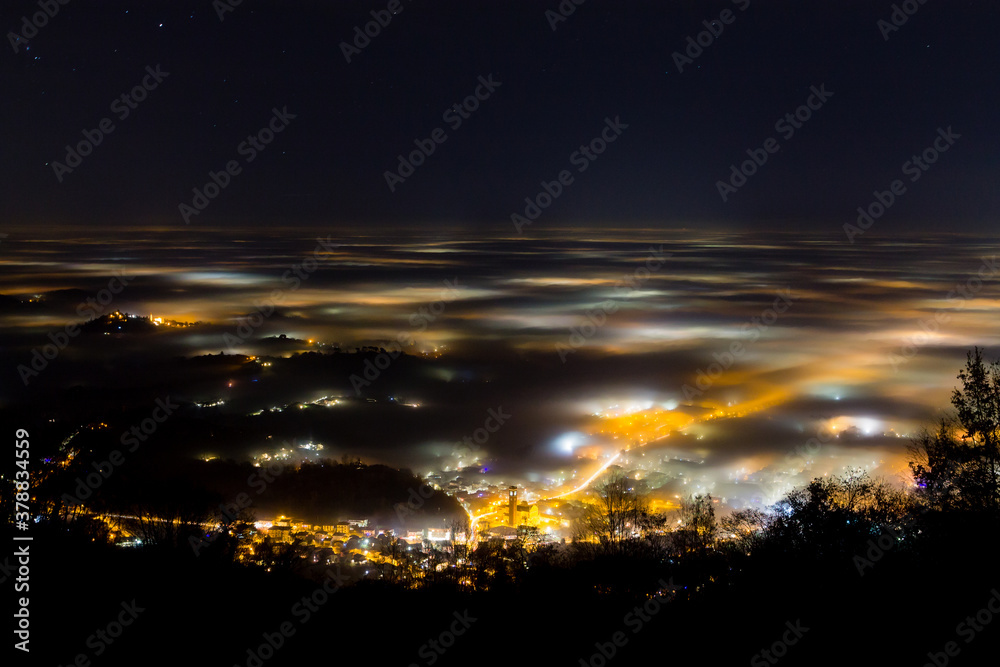 Plain illuminated partially covered by fog, soft lights Plain illuminated partially covered by fog, soft lights