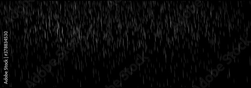 rain falling on dark background. Falling raindrops, the rain water drop falling in rainy season.