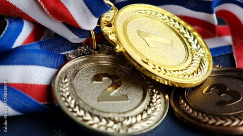 concept for winning or success. Gold medal, silver medal and bronze medal on yellow background. video stock footage photo