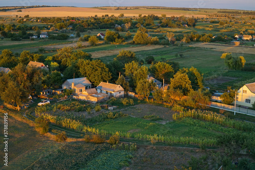 Wallpaper Mural View of the village on the plain from above in the rays of the sunset Torontodigital.ca