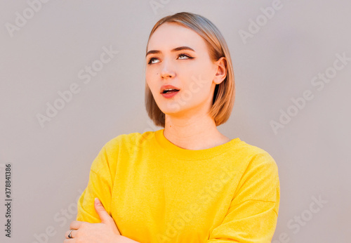 Arrogant facial expression, pre-teen girl rolled her eyes, background, emotions series. photo
