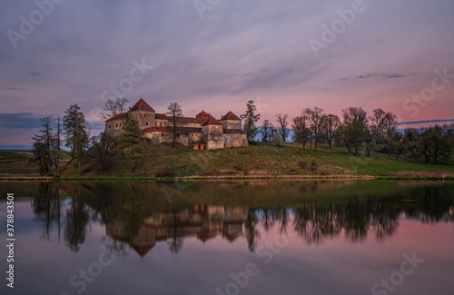 Ancient Svirzh castle at sunset in april 2020. Svirzh village, Lviv region.