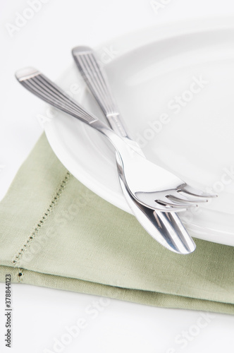 Close-up of a fork and knife on a plate