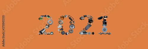 Number 2021 written with truck, tractors and car spare parts.New year concept for repair shop, workshop, diy isolated on Amber Glow background. Banner.
