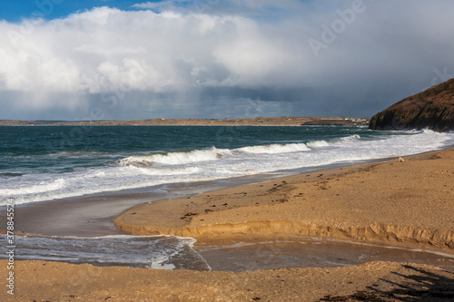 Carbis Bay (aka Barrepta Cove), and the view across St. Ives' Bay to Gwithian, Cornwall, England, UK.  Beach scene with waves photo